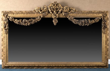 LARGE 19TH C. CARVED & GILT WALL MIRROR.