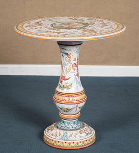 GINORI MAJOLICA PORCELAIN TABLE.: An early 20th C. Italian majolica two-part center table, elaborate designs of cornucopia, flowers, birds, masks, figures in eating fruit garden, and more. Signed on bottom āExclusively for Ginor
