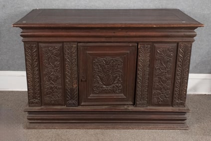 LATE 18TH C. CARVED OAK STORAGE TRUNK.