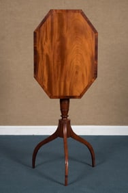 ANTIQUE MAHOGANY TILT TOP CANDLE STAND.