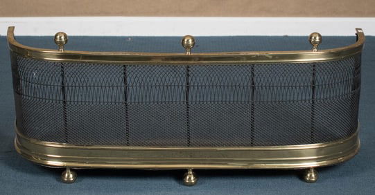 ANTIQUE BRASS AND IRON FIREPLACE FENDER.