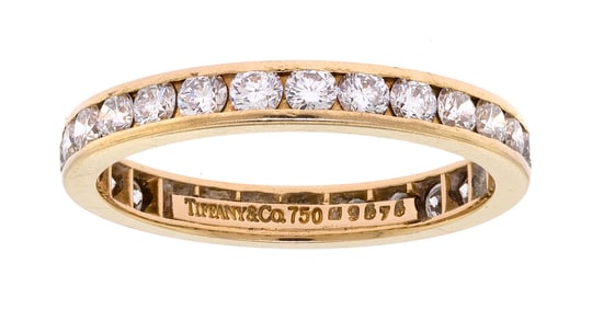 TIFFANY & CO. 18K GOLD DIAMOND ETERNITY BAND.