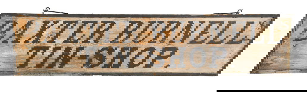 BAXTER BURNELLS TIN-SHOP TRADE SIGN.: A late 19th C. double-sided painted wood trade sign, ‘Baxter Burnell’s Tin-Shop’. 16.5&rdquo;H x 74&rdquo;W.