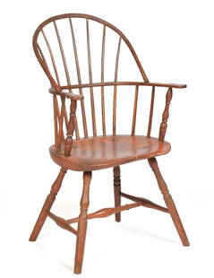 18TH C. RED PAINTED WINDSOR ARM CHAIR.: A ca. 1780 Windsor sack-back arm chair in old salmon/red color, with a bow back and shaped arms, saddle seat, vase and ring turned legs, 39&#8221;H x 22&#8221;W x 20&#8221;D x 17&#8221; seat H.