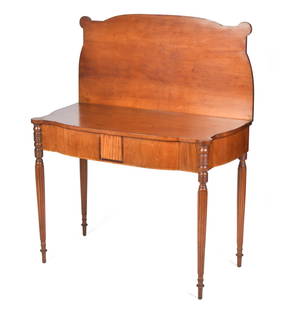 19TH C. FEDERAL MA INLAID GAMES TABLE.: A ca. 1810-1820 MA ovolo games table, with a hinged top and back leg swing support, a mahogany and tiger maple veneered front apron on fine reeded legs, 29&#8221;H x 37&#8221;W x 18.5&#8221;D. Provena