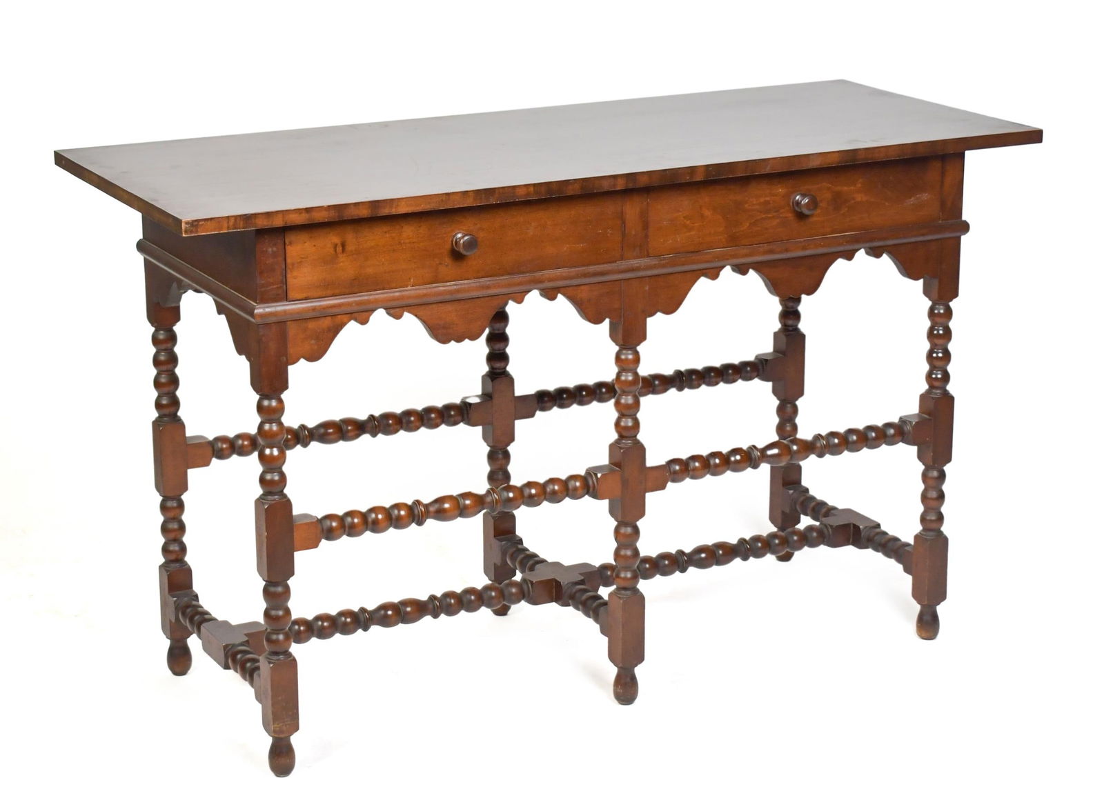 WALLACE NUTTING WILLIAM AND MARY STYLE SIDE TABLE.: An early 20th C. maple and pine two drawer side table with ring turned William and Mary stretcher base, interior drawer branded Wallace Nutting, 30.5”H x 50.5”W x 20”D. Provenance: T