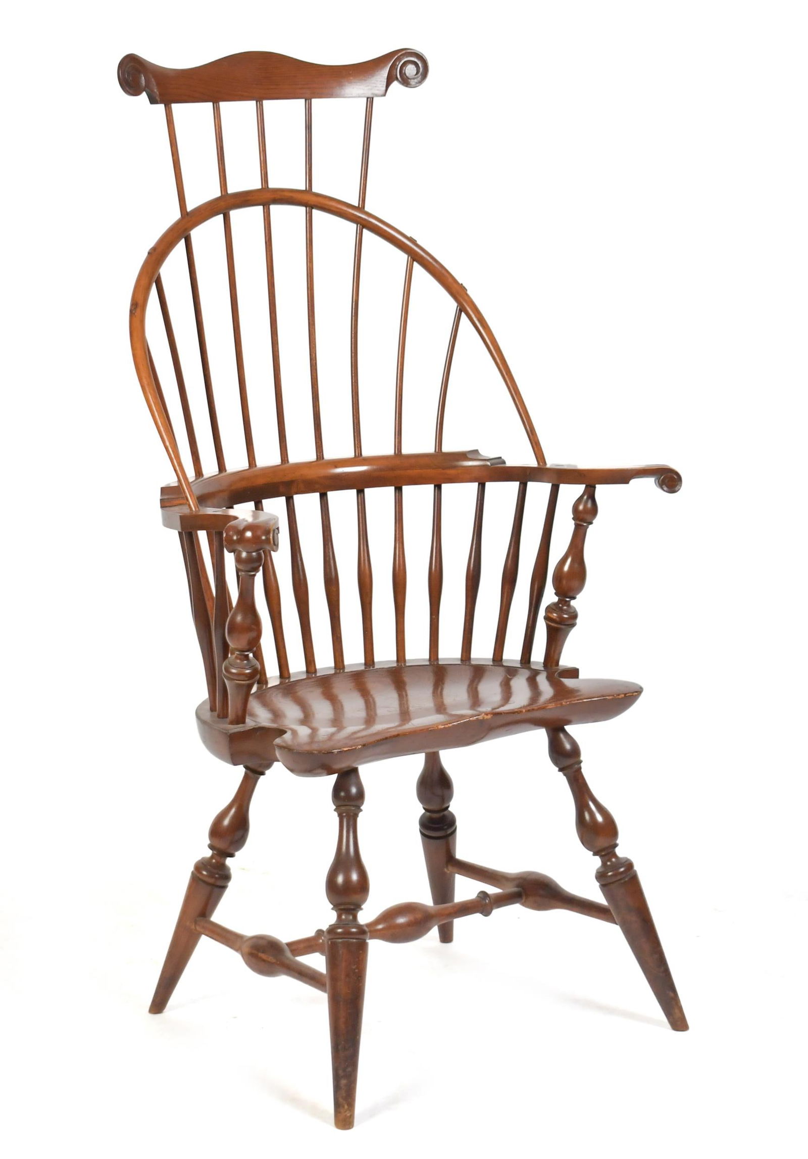 WALLACE NUTTING COMB AND SACK BACK ARMCHAIR.: Early 20th C. Wallace Nutting maple bow-back armchair with a hickory carved ear comb back with knuckle arms. Has a pine saddle seat with vase and ring turned legs, branded Wallace Nutting on underside