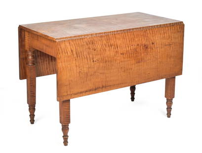AMERICAN 19TH C. TIGER MAPLE DROP LEAF TABLE.: An American 19th C. solid tiger maple drop leaf dining table with NY State turned legs, 29&#8221;H x 41.5&#8221;L x 21.25&#8221;W (leaves down) x 50&#8221;W (leaves up).