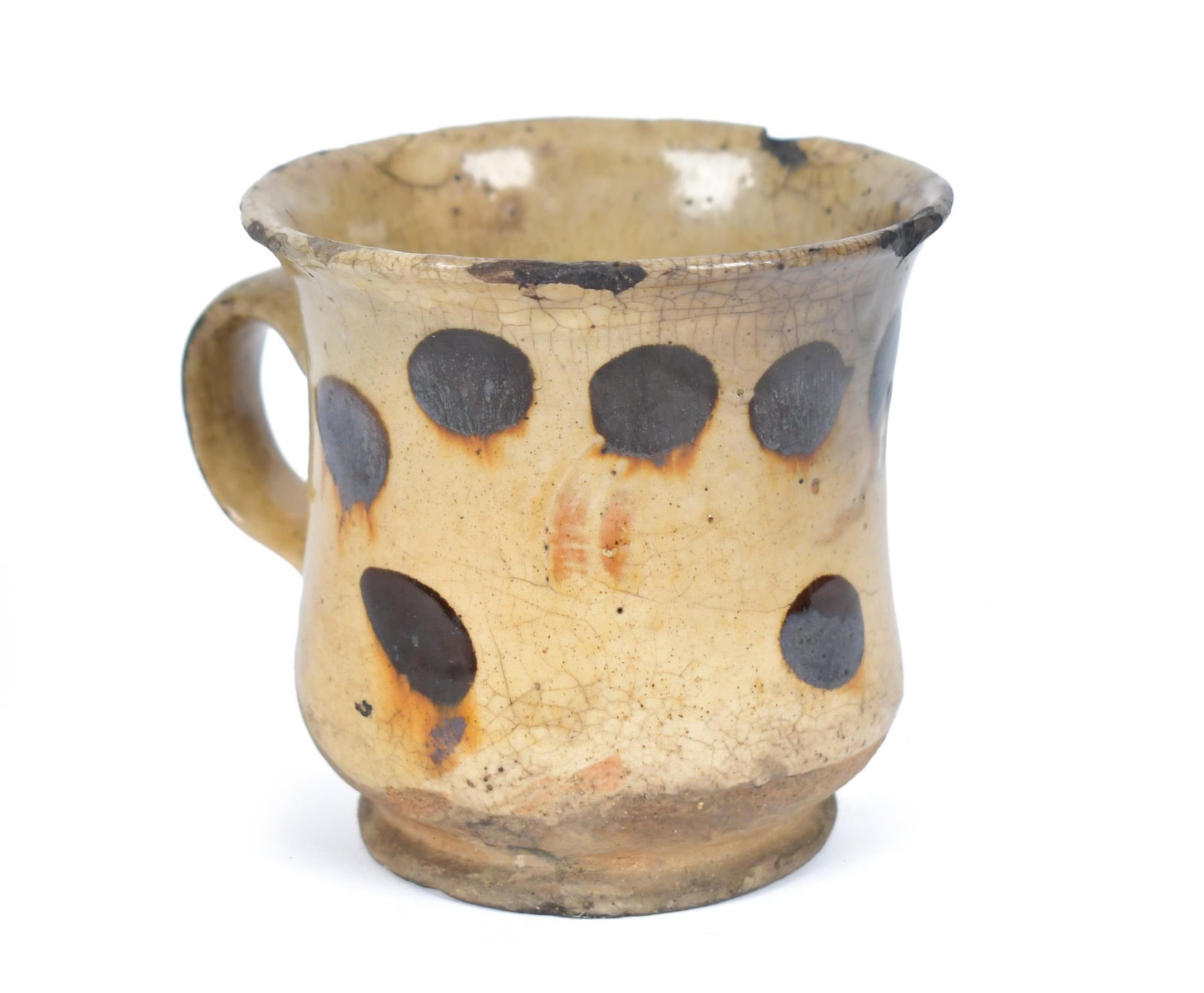 18TH C. SLIPWARE DOTWARE MUG.: An 18th C. English slip decorated earthenware mug with dot decoration, 3.3”H. Provenance: Hollis Brodrick, William Parsons House, Gilmanton, NH private collection.