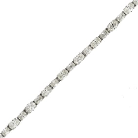 PLATINUM 10 CT. TW. OVAL DIAMOND LINE BRACELET.