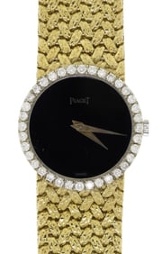 VINTAGE LADYS 18K GOLD PIAGET DIAMOND WRIST WATCH.