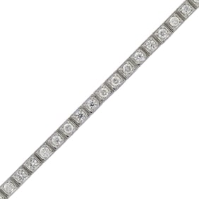 18K GOLD ILLUSION SET DIAMOND BRACELET.