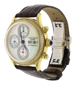 18K GOLD CHASE DURER M.O.P. DIAL DAY/DATE WATCH.