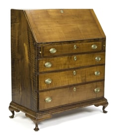 A 18TH C. NH TIGER MAPLE DESK ON FRAME.