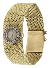 MID-CENTURY 14K GOLD DIAMOND WRIST WATCH.