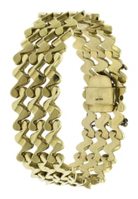 18K GOLD WIDE SQUIGGLE LINK BRACELET.