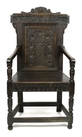 17TH C. CARVED OAK ARM CHAIR.