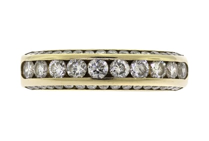 14K GOLD CHANNEL SET DIAMOND BAND.