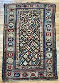 ANTIQUE CAUCASIAN SCATTER RUG.