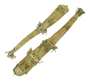 TWO EARLY 20TH C. EMBROIDERED HIDE RIFLE SCABBARDS.