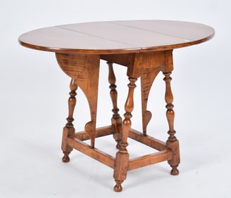 LATE 19TH C./ E. 20TH C. TIGER MAPLE BUTTERFLY TABLE.
