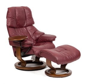 STRESSLESS MAROON LEATHER CHAIR AND OTTOMAN.