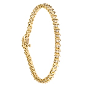 14K GOLD DIAMOND ”S” LINK BRACELET.