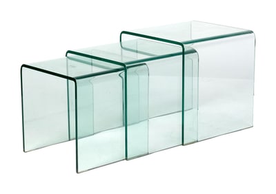 THREE 1970S NESTING GLASS TABLES.