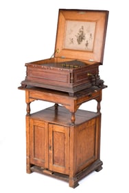 ANTIQUE REGINA MUSIC BOX WITH 50 DISCS.