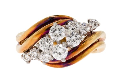 18K YELLOW GOLD BYPASS DIAMOND CLUSTER RING.