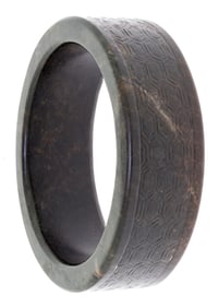 CHINESE CARVED BROWN JADE OR HARDSTONE BANGLE.