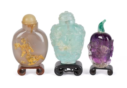 THREE ANTIQUE CHINESE STONE SNUFF BOTTLES.