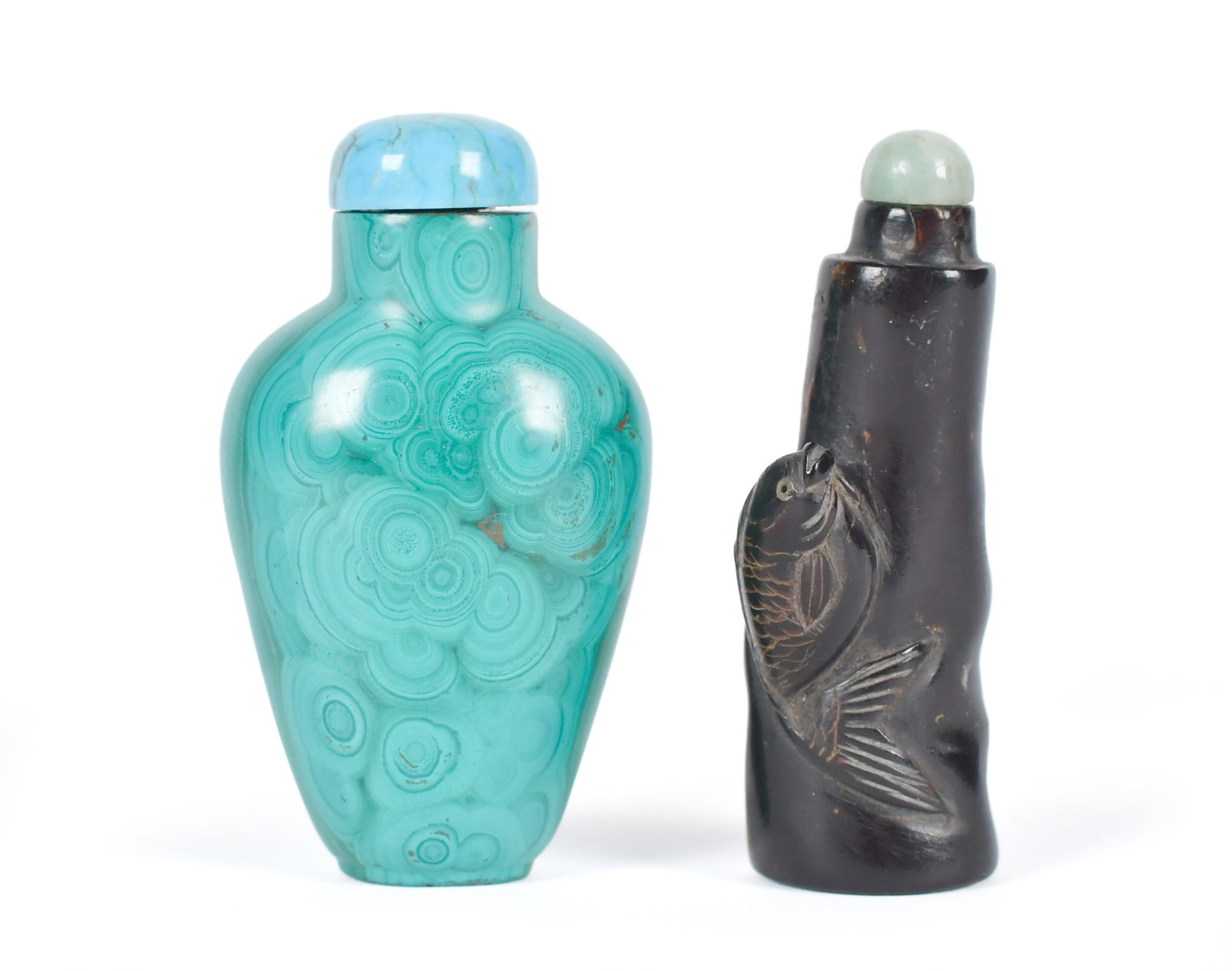 TWO ANTIQUE CHINESE SNUFF BOTTLES, ZITAN & MALACHITE: Two 19th C. Chinese snuff bottles, including a Zitan wood example with high relief fish carving, fitted with a domed green jadeite stopper, 2.5”H. With a carved solid malachite example with turq