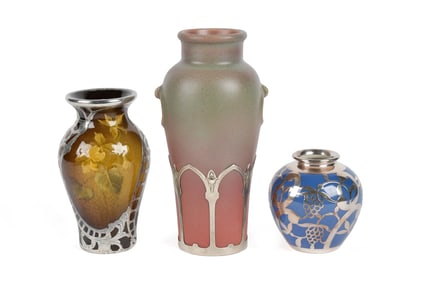 THREE ANTIQUE STERLING MOUNTED ART POTTERY VASES.