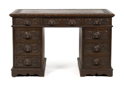 19TH C. CARVED OAK KNEEHOLE DESK.