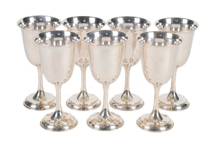 SET OF SEVEN STERLING SILVER CHALICES.