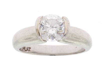 PLATINUM HALF BEZEL .94 CT. DIAMOND ENGAGEMENT RING.