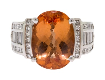 18K GOLD ORANGE TOURMALINE & DIAMOND RING.