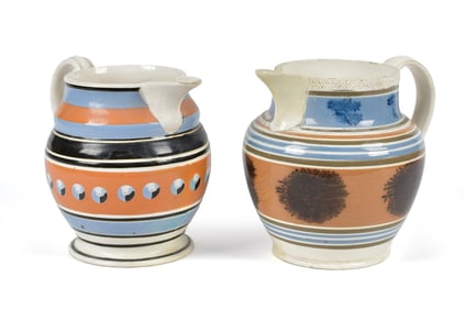 TWO ANTIQUE MOCHA WARE PITCHERS.