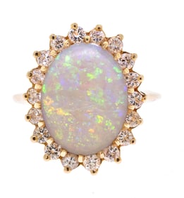 VINTAGE 14K GOLD OPAL & DIAMOND HALO RING.