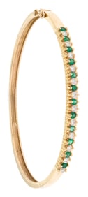 18K GOLD HINGED BANGLE W/ EMERALDS & DIAMONDS.