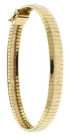 14K YELLOW GOLD OMEGA BRACELET.