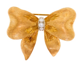 VINTAGE 18K GOLD DIAMOND BOW PIN.