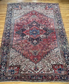 ANTIQUE HERIZ ROOM SIZE ORIENTAL RUG.