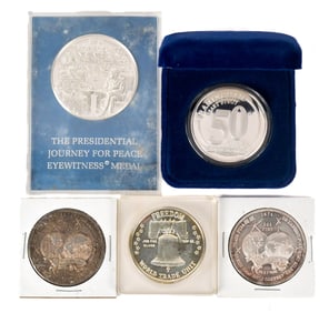 FOUR TROY OZ OF .999 SILVER AND A STERLING MEDAL.