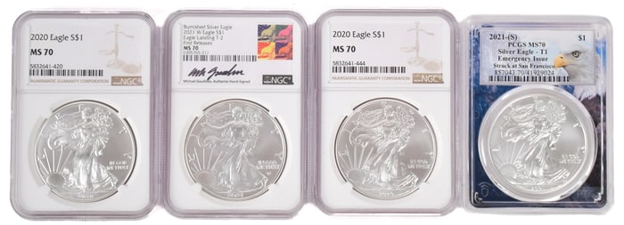 FOUR AMERICAN SILVER EAGLE COINS.