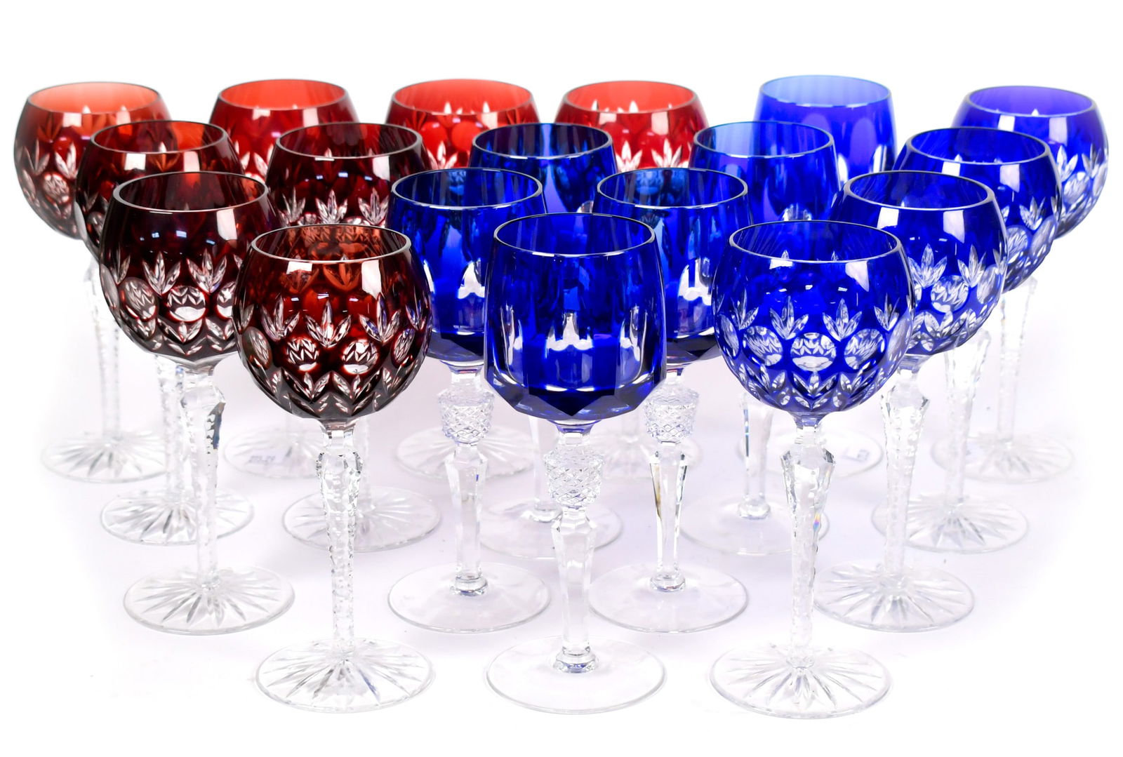 THREE SETS VINTAGE CUT OVERLAY CRYSTAL WINES, 18 PCS.: Three sets of vintage cut overlay wines, including: six Nachtmann cobalt examples 8”H, eight ruby red examples, 7.75”H, and four unsigned cobalt examples 7.75”H.