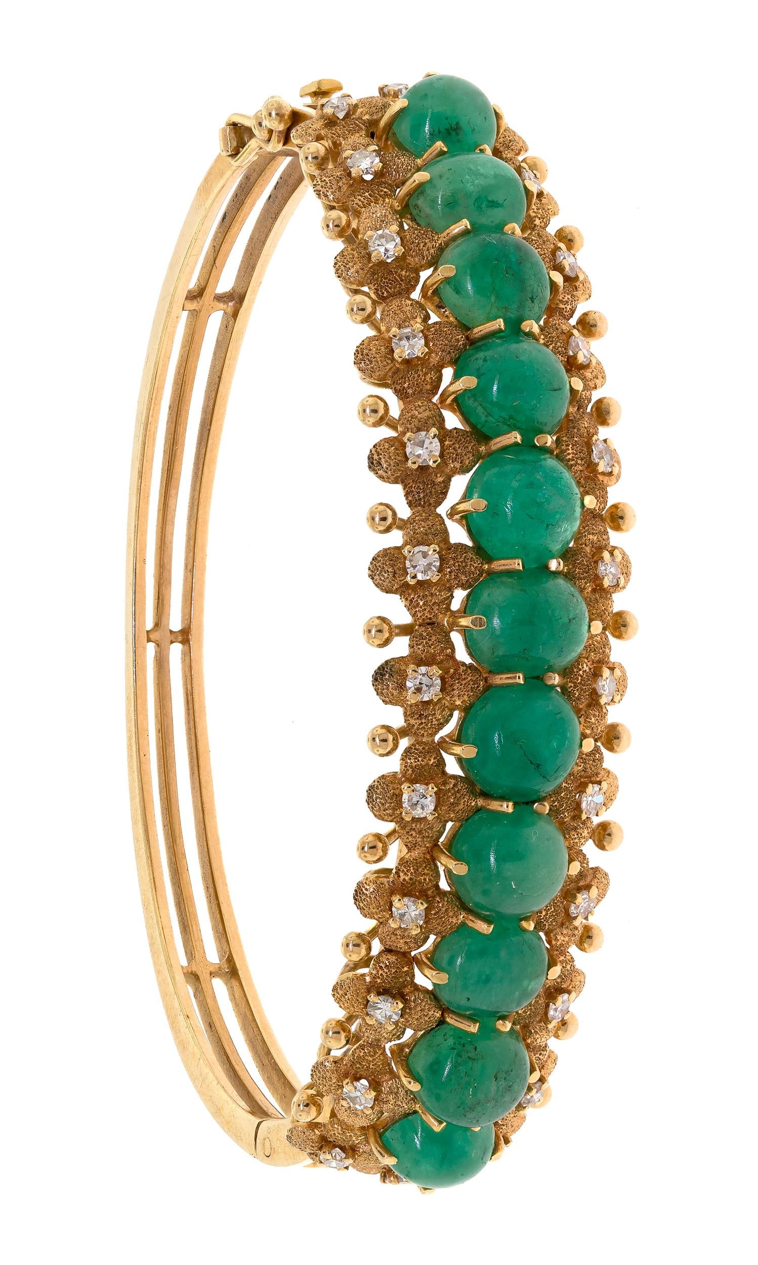 14K GOLD EMERALD CABOCHON & DIAMOND BRACELET.: A vintage, 14k yellow gold (stamped) hinged bangle bracelet set with approx. 11 ct. tw. of medium light green, emerald cabochons and approx. .65 ct. tw. single cut round, natural diamonds of G-H