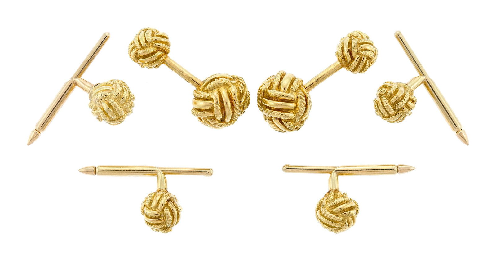 TIFFANY & CO. SCHLUMBERGER KNOT CUFFLINKS & STUD SET.: A pair of Tiffany & Co., Schlumberger, signed, 18k yellow gold (stamped), love knot cufflinks (11mm) and set of four shirt studs (8.5mm), 1 inch long cufflinks, 44.9 grams.