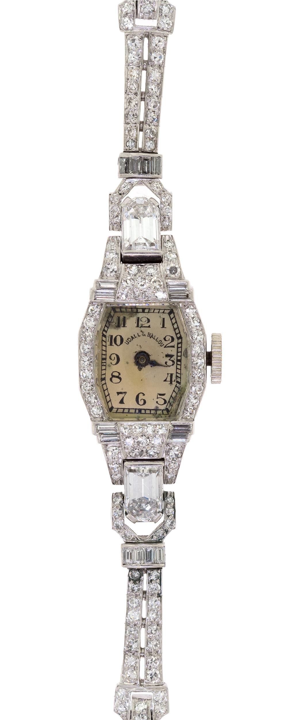 LADY'S ART DECO PLATINUM & DIAMOND WRIST WATCH.: A lady's, Art Deco, Udall & Ballou, platinum (stamped) wrist watch, Longines, 15 jewel movement, set with approx. 3.5 ct. tw. single cut round, baguette and modified baguette cut with one rounded end